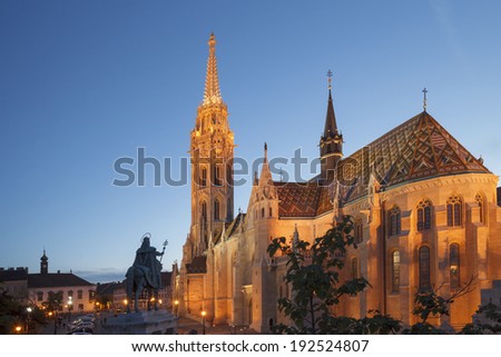 BUDAPEST MAY 10 2014: Newly renovated Mathias Church in Budapest is a big attraction for tourists all over the world. Budapest\'s beauty shown at night through many centuries of architecture, Hungary.
