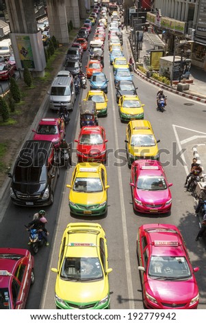 BANGKOK APRIL 27: Traffic moves slowly along a busy road in Sathorn district on April 27 2014 in Thailand. Annually an estimated 150,000 new cars join the heavily congested roads of Bangkok.