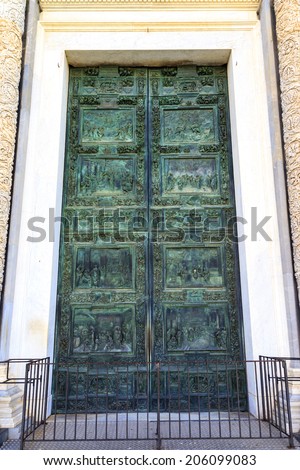 FLORENCE, ITALY - MAY 20 2014: Gates of Paradise, famous bronze doors with relief sculptures at Florence Baptistery, one of the oldest buildings in the city, Florence, Italy