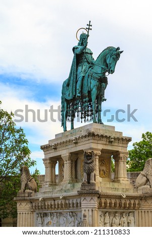 BUDAPEST MAY 11 2014: View of St. Stephen Statue and Matthias Church at Fishermen\'s Bastion, is one of the most-visited attractions in Budapest, on 11 May 2014 Hungary.