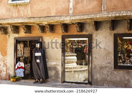 VENICE, ITALY - JUN 1, 2014: Souvenirs shop  like this offer all kind of present and souvenirs to tourist in all section of town. This is a major income source for the local population.