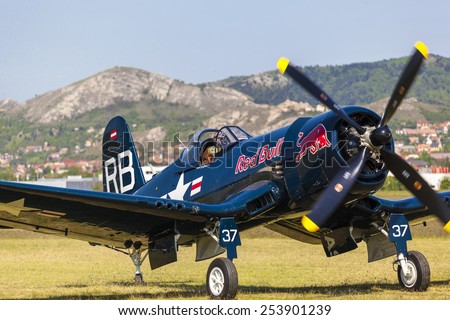 BUDAPEST, HUNGARY - MAY 1: Corsair historic fighter bomber plane fly-by with Red Bull marking on it\'s fuselage on May1, 2014 in Hungary