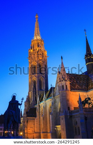 BUDAPEST MAY 9 2014: Newly renovated Mathias Church in Budapest is a big attraction for tourists all over the world. Budapest's beauty shown at night through many centuries of architecture, Hungary.