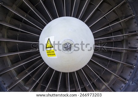 Airplane gas turbine engine detail Gas Turbine Jet Engine with Hungarian  warning label on it.