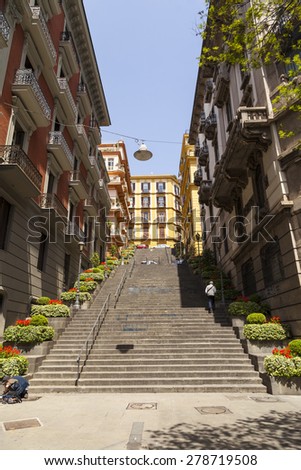 NAPLES, ITALY - MAY 22, 2014: Classical romantic small street in the historical center of Naples, Italy. Naples is the the third-largest city in Italy with about 1 million residents