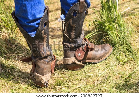 WATER VALLEY, CANADA - JUN 6 2015: Cowboy  in his special boot standing by in the the Water Valley Rodeo.This annual event is important for the rural as well as the sport loving community.