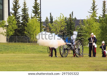 CALGARY, CANADA - JUN 13: Exhibits outside the Military Museums  in Calgary, Alberta Canada. It is made of museums dedicated to representing Canada\'s navy, army, and air force. Soldiers with cannon.