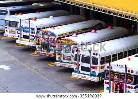 PANAMA CITY, PANAMA, OCTOBER 21 2015. Painted and colorful public busses in Panama City Main Bus Station.  Provides the backbone of personal, affordable  long distance transportation for the public.