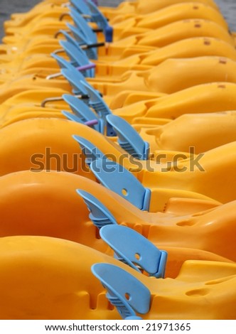 Yellow pedal boats waiting to be rented