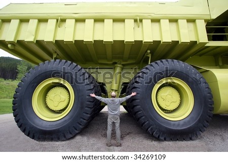 Earth moving dump truck with a man at the wheel