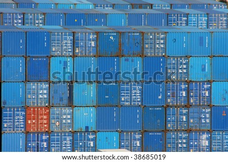 Stack of blue sea containers in an international port  container shipping