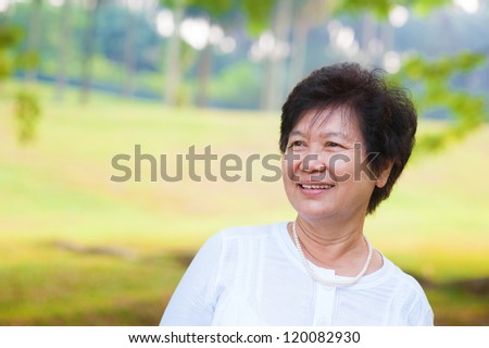 60\'s Asian senior woman at park in a morning