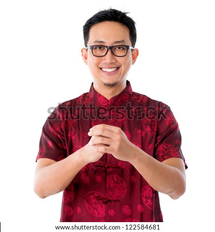 China man in traditional Chinese Tang suit greeting, isolated on white background