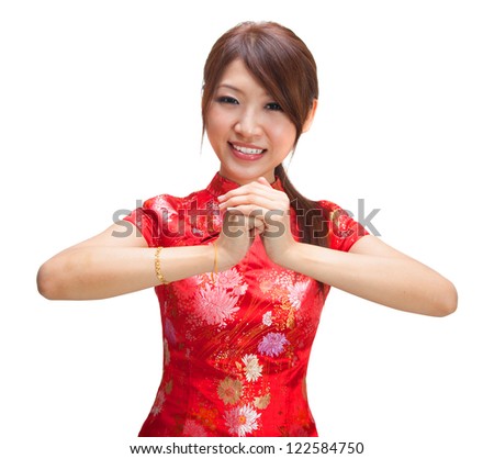 Chinese girl in traditional Chinese cheongsam greeting, isolated on white background