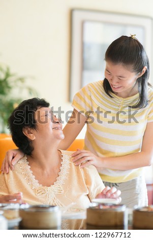 Asian Chinese family interaction inside a restaurant