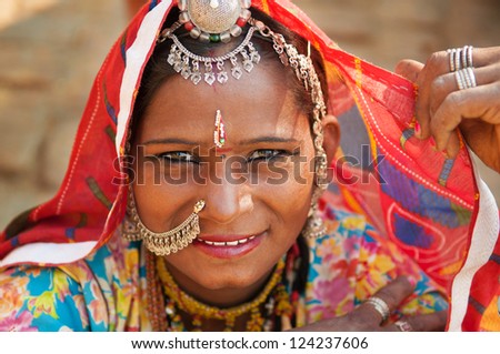 Beautiful Traditional Indian woman in sari costume covered her head with veil, India