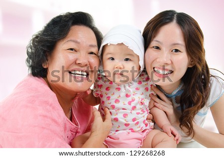 Family at home. Three generations Asian family, grandmother, mother and granddaughter.