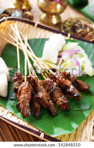 Beef satay, roasted meat skewer Asia food.  Traditional Southeast Asia food.  Hot and spicy Southeast Asian dish, Asian cuisine.