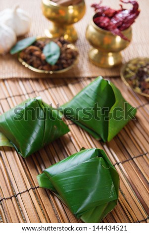Nasi lemak, popular traditional Malaysian food wrapped with banana leaf.