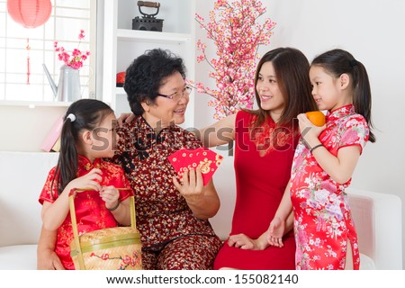 Happy Multi Generations Asian Family Celebrate Chinese New Year At Home.