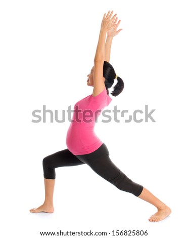Pregnancy yoga class. Full length healthy Asian pregnant woman doing yoga exercise stretching, full body isolated on white background. Yoga positions warrior 1.