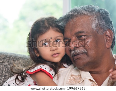 Portrait Indian family at home. Grandparent and grandchild close up face. Asian people living lifestyle. Grandfather and granddaughter.