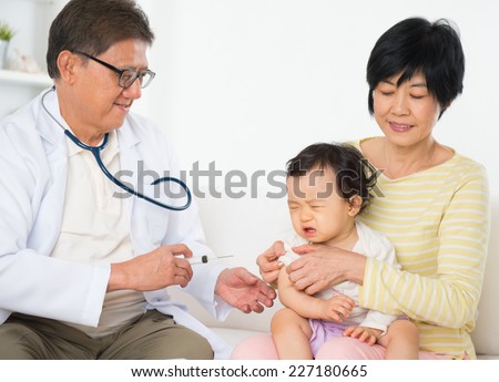 Family doctor vaccines  or injection to baby girl. Pediatrician and patient.