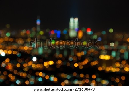 Blurred lights of Kuala Lumpur skyline, purposely defocused.