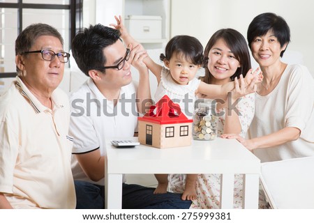 Family money saving or future financial planning concept. Asian multi generations lifestyle at home.