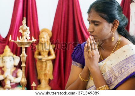 Woman hand folded during praying events. Traditional Indian Hindus ear piercing ceremony. India special rituals.