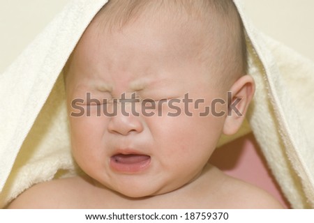 Crying 6 months old Asian baby boy