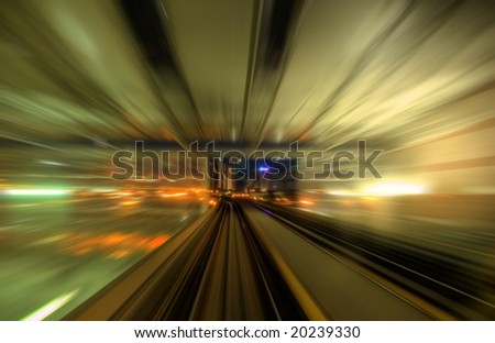 Speedy trains passing train station. Focus on the rail road.