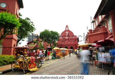 Tourist activity in front Christ Church. Christ Church is in the main square adjacent to Stadthuys, Melaka, Malaysia.