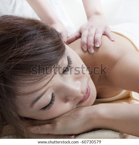 Beauty and Spa - Asian Girl having a massage on her back