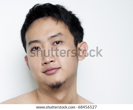 stock photo Pan Asian male portrait on plain background