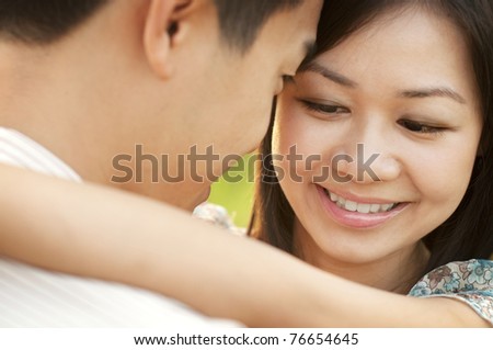Loving Couple face to face at outdoor during sunset