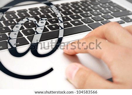 internet background hand writing on silver laptop touchpad keyboard