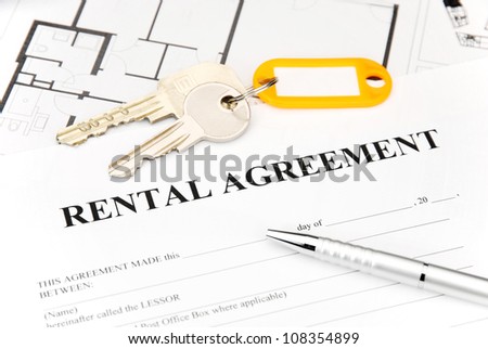 rental agreement document with keys and pencil