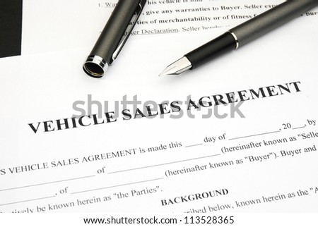 Vehicle Sales agreement document form with pen