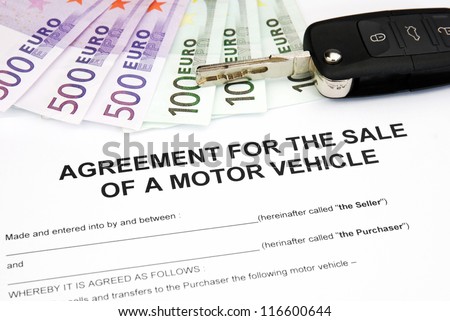 agreement document contract for sale of a motor vehicle with car key and money