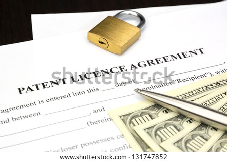 Document Form of patent licence agreement with lock and dollar money