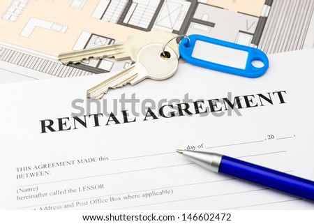 rental agreement document with keys and blue pen