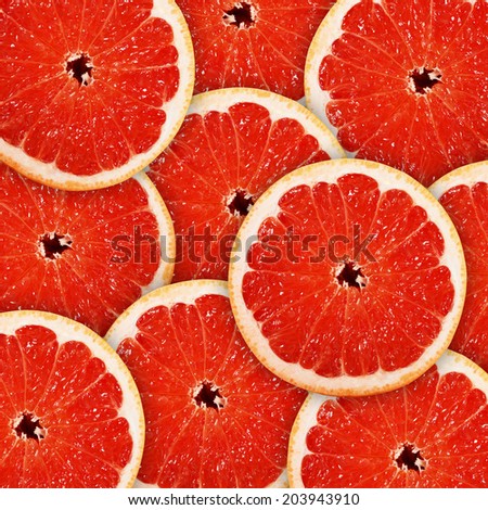 background of heap fresh red grapefruit slices