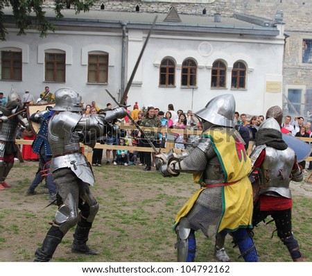KAMYANETS PODILSKY, UKRAINE - JUNE 2: unidentified knights fight during Forpost (The Outpost) Festival of Medieval Culture on June 2, 2012, Kamyanets Podilsky, Ukraine