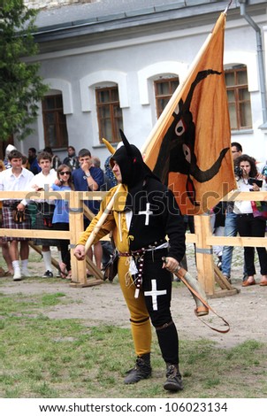 KAMYANETS-PODILSKY- JUNE 2: Team mascot with flag and horn during Forpost (The Outpost) Festival of Medieval Culture on June 2, Ukraine