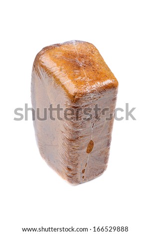 Close-up of black bread in polyethylene packaging isolated on wh
