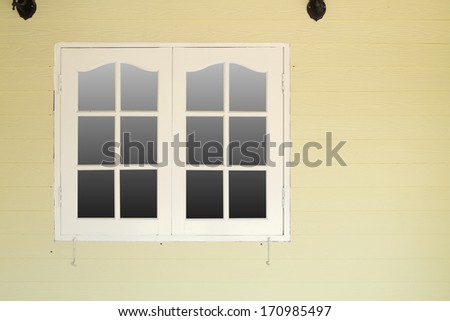 wooden window on wooden wall (vintage style)