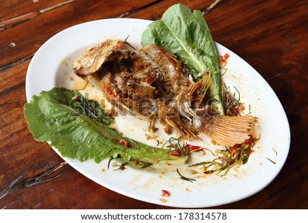 eaten Fried ruby fish topped with sweet,sauer and hot sauce on dish