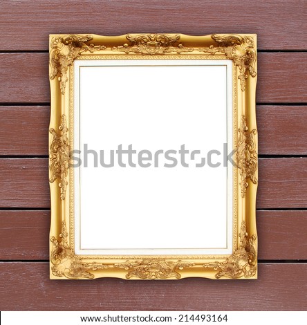 blank golden frame on wood wall background