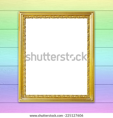 blank golden frame on colorful wood wall background